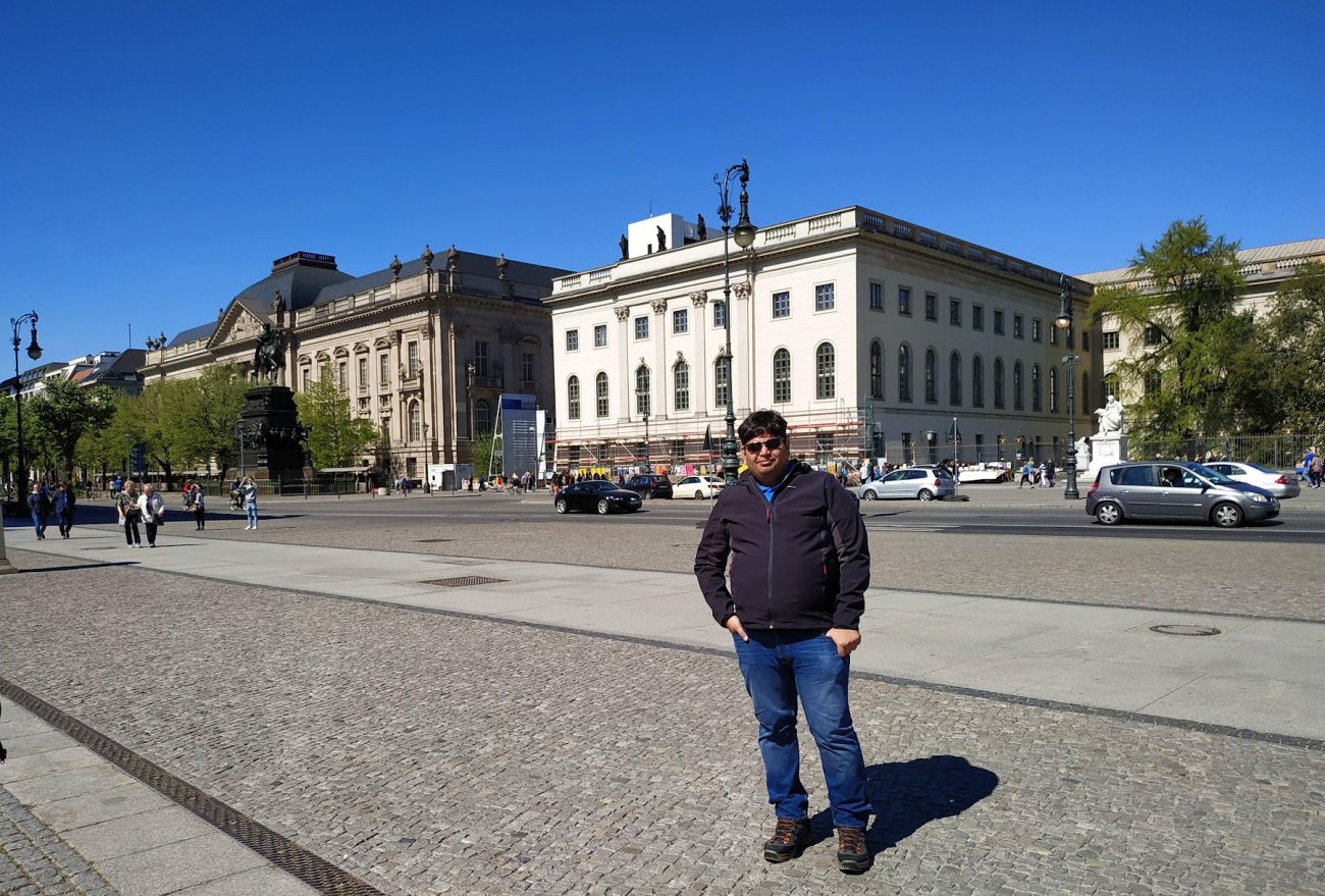 Vishwa Ranjan at Bebelplatz, Unter den Linden, with Humboldt University behind